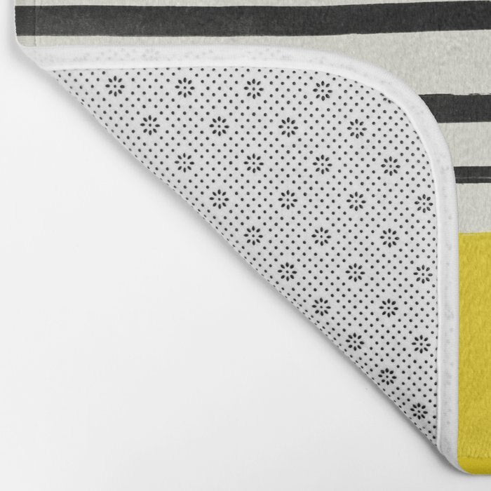 Yellow and black stripe bath mat